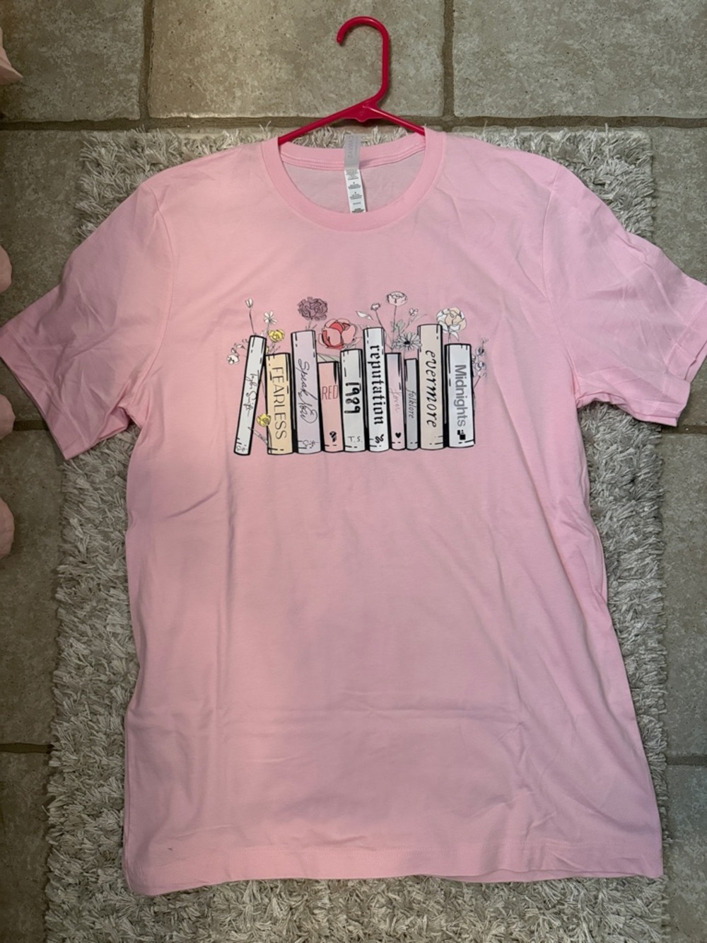 Soft Pink Taylor Swift T-Shirt with Book Illustration album names
